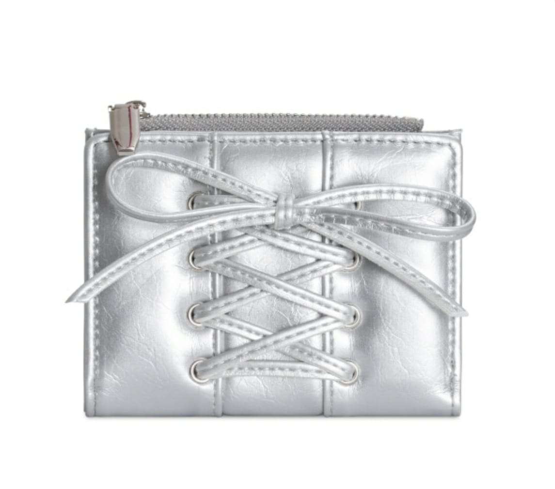 Silver metallic pouch with white laces on a white background