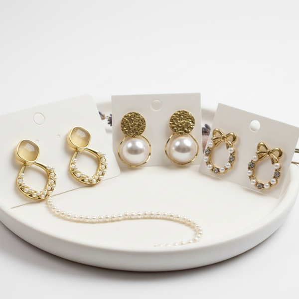 Set of gold and pearl earrings for gifting