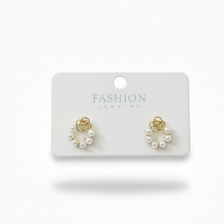 Pair of earrings on a 'Fashion' branded card against a white background