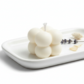 For your next gift buy Three white candles on a white plate with lavender flowers 