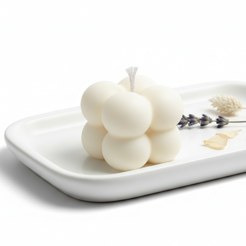 For your next gift buy Three white candles on a white plate with lavender flowers 