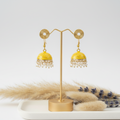 Yellow Jhumka with a soft white background